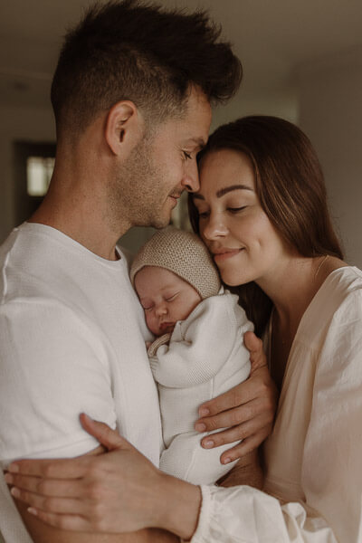 Photos by Jordi - Newborn breastfeeding image in black and white.