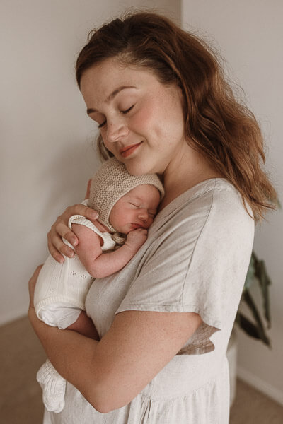 Photos by Jordi - Mother and baby indoor natural light photography.