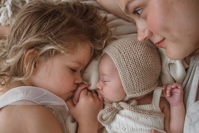 Photos by Jordi - Tender moment between mother and newborn.